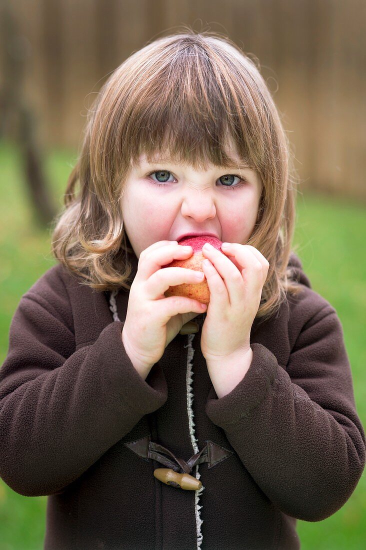 Girl eating an apple