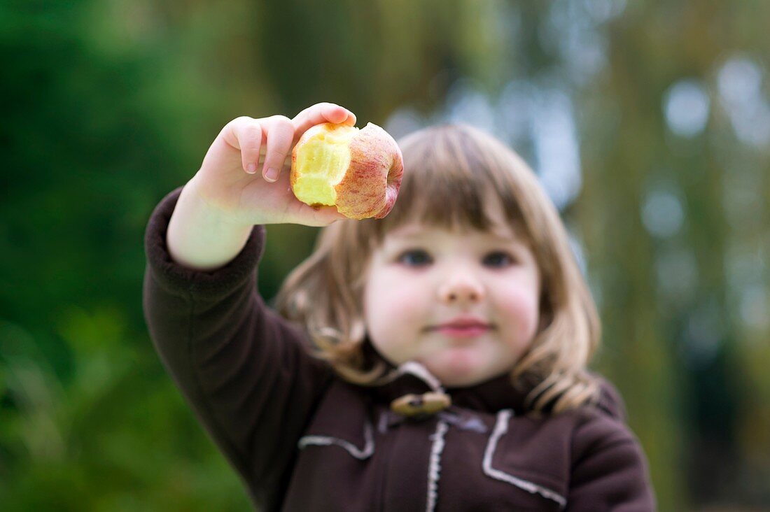 Girl holding an apple