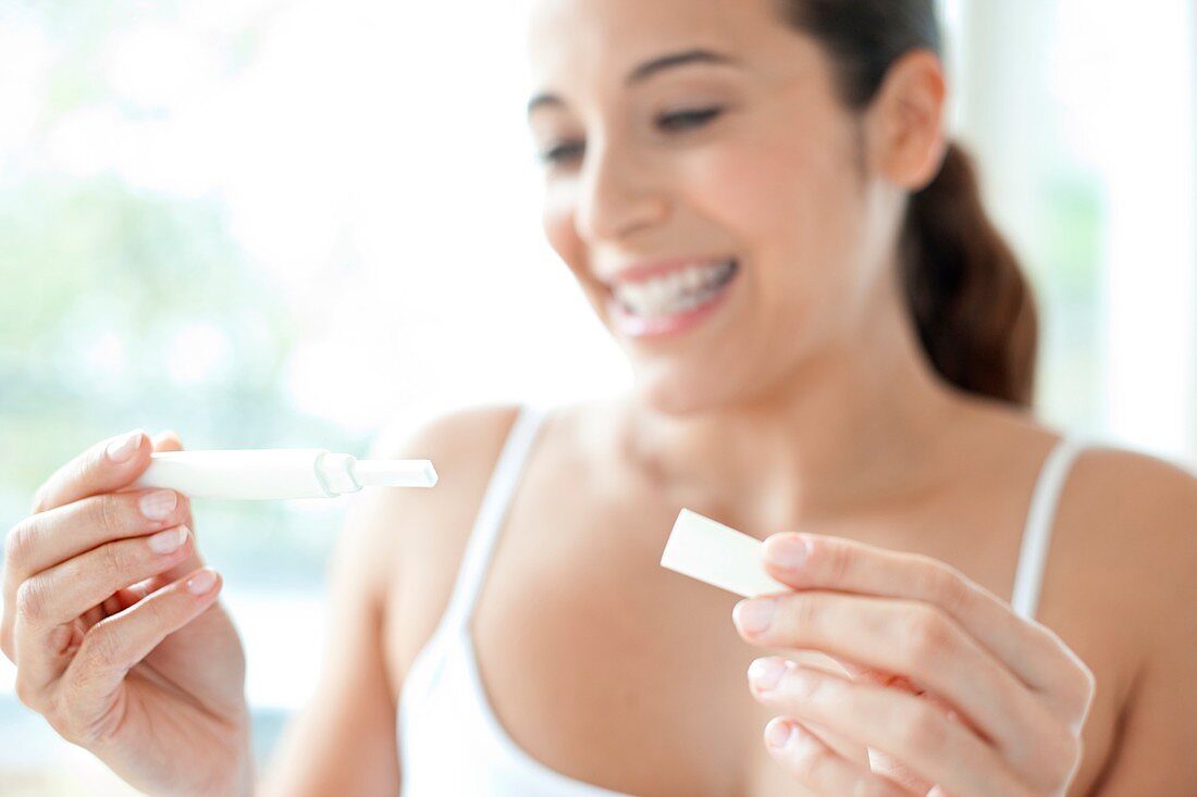Woman taking pregnancy test
