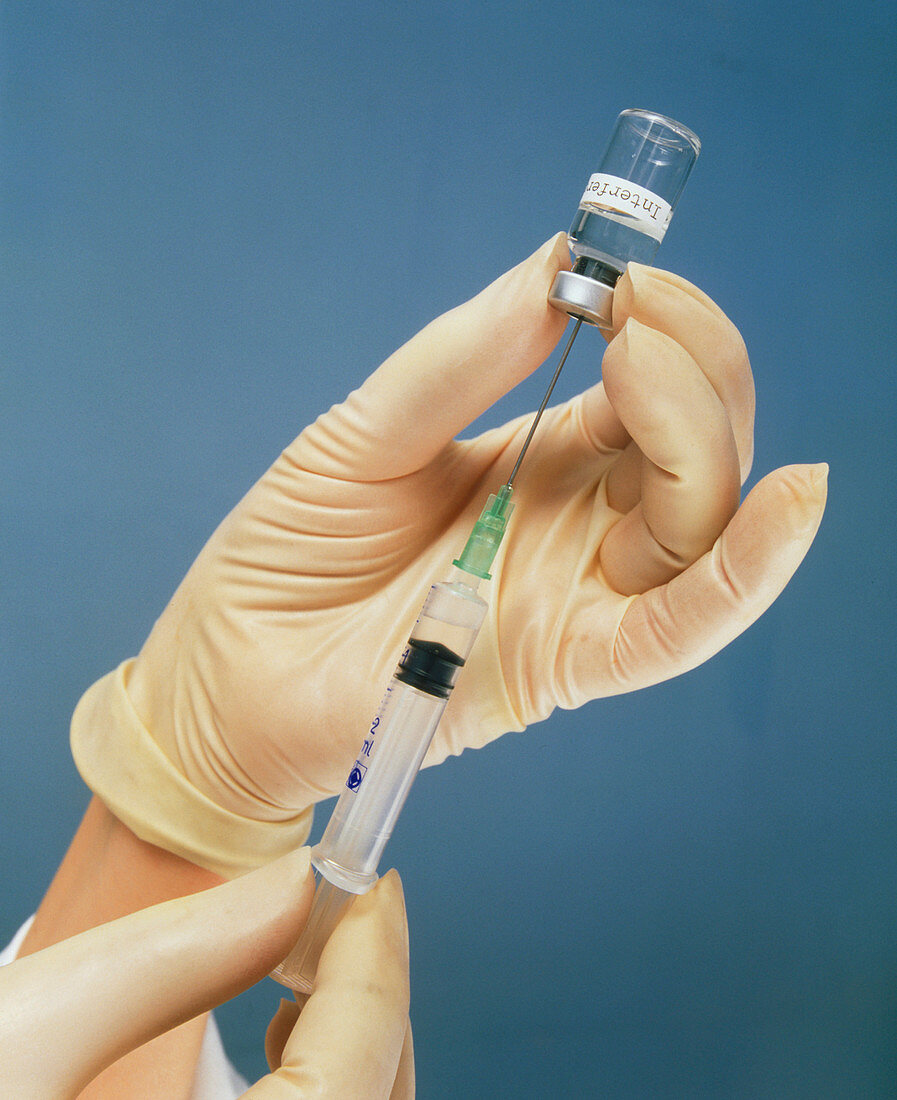 Syringe used to draw interferon drug from a vial