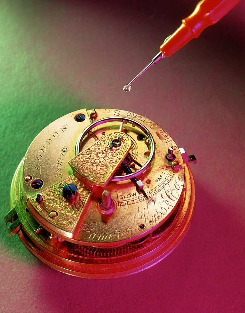 Oiling the balance arm of a pocket watch
