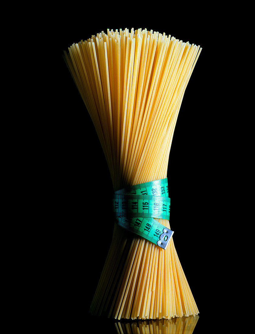 Sheaf of spaghetti tied with a tape measure