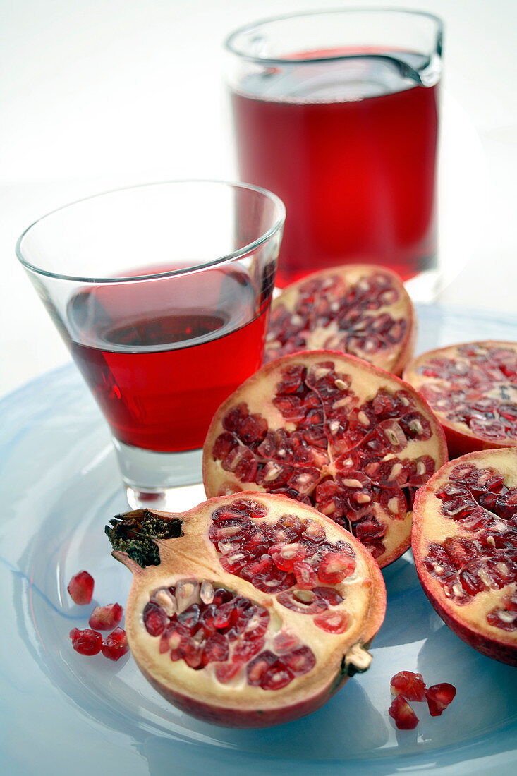 Pomegranate fruits and juice