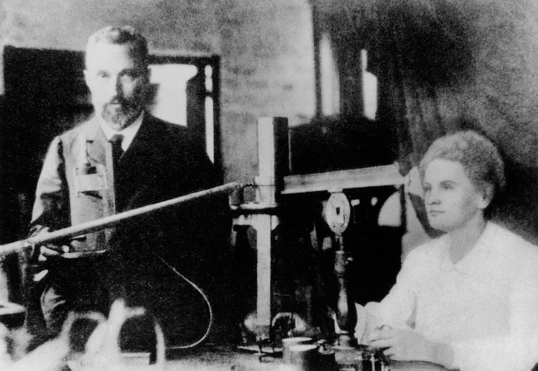 Marie and Pierre Curie in laboratory
