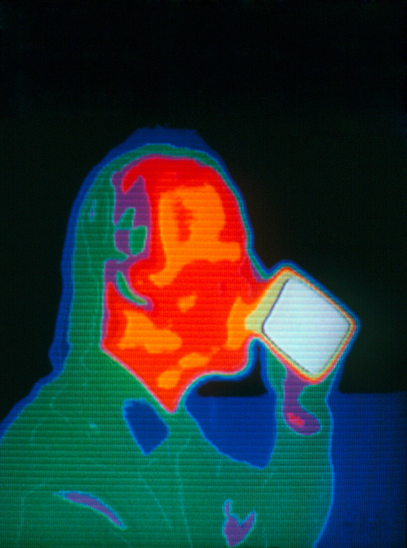 Thermogram of man drinking mug of coffee