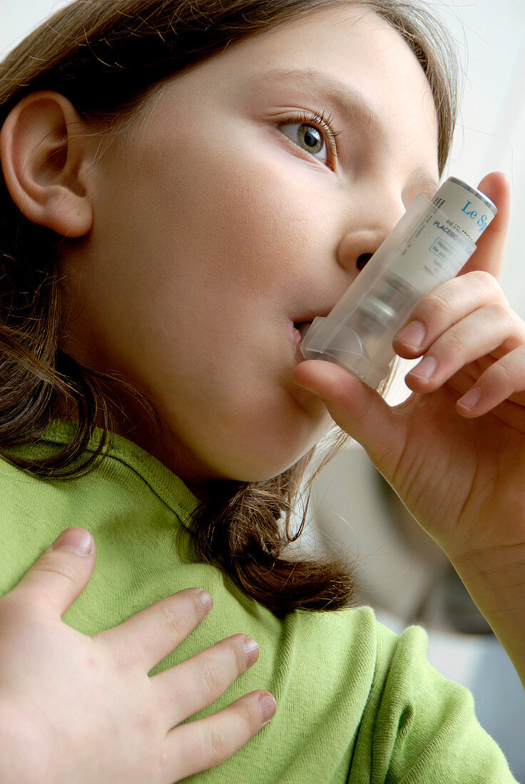 Girl using an inhaler