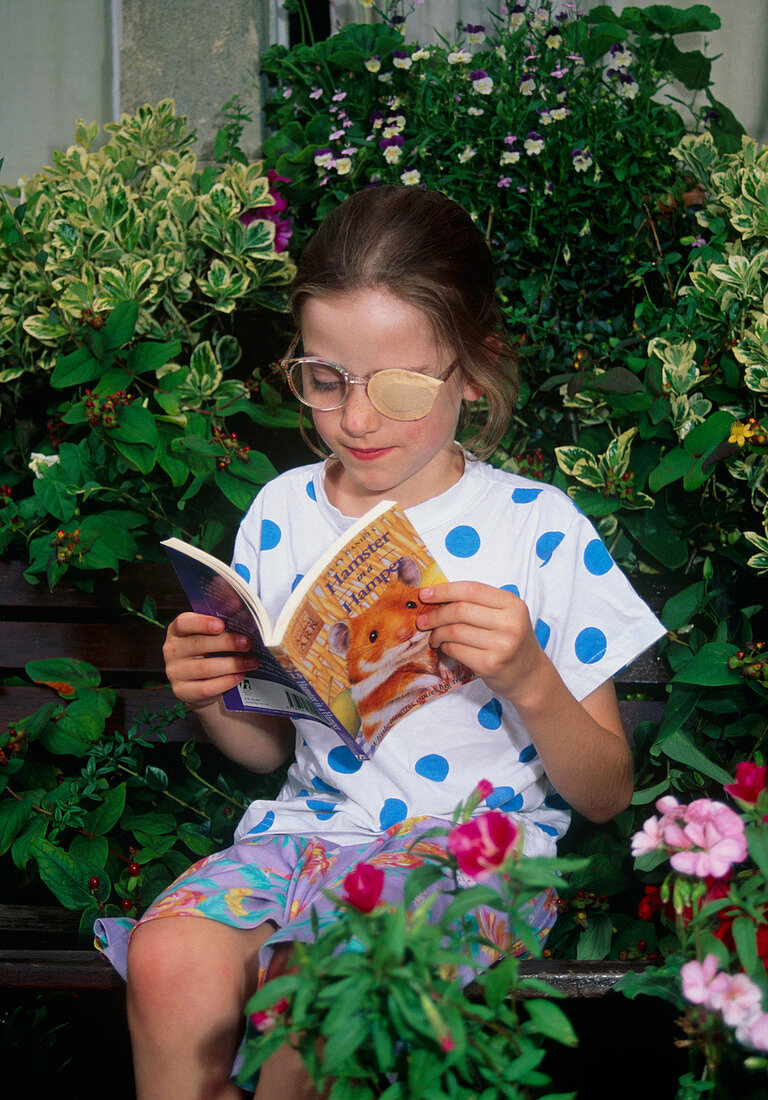 Girl,aged 8,wearing eye patch to treat lazy eye