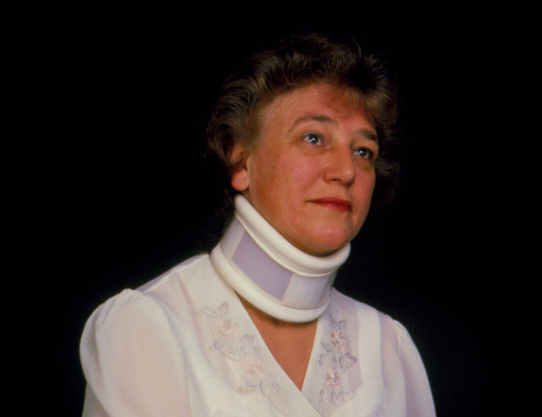 Orthopaedic neck collar on a woman (winter)