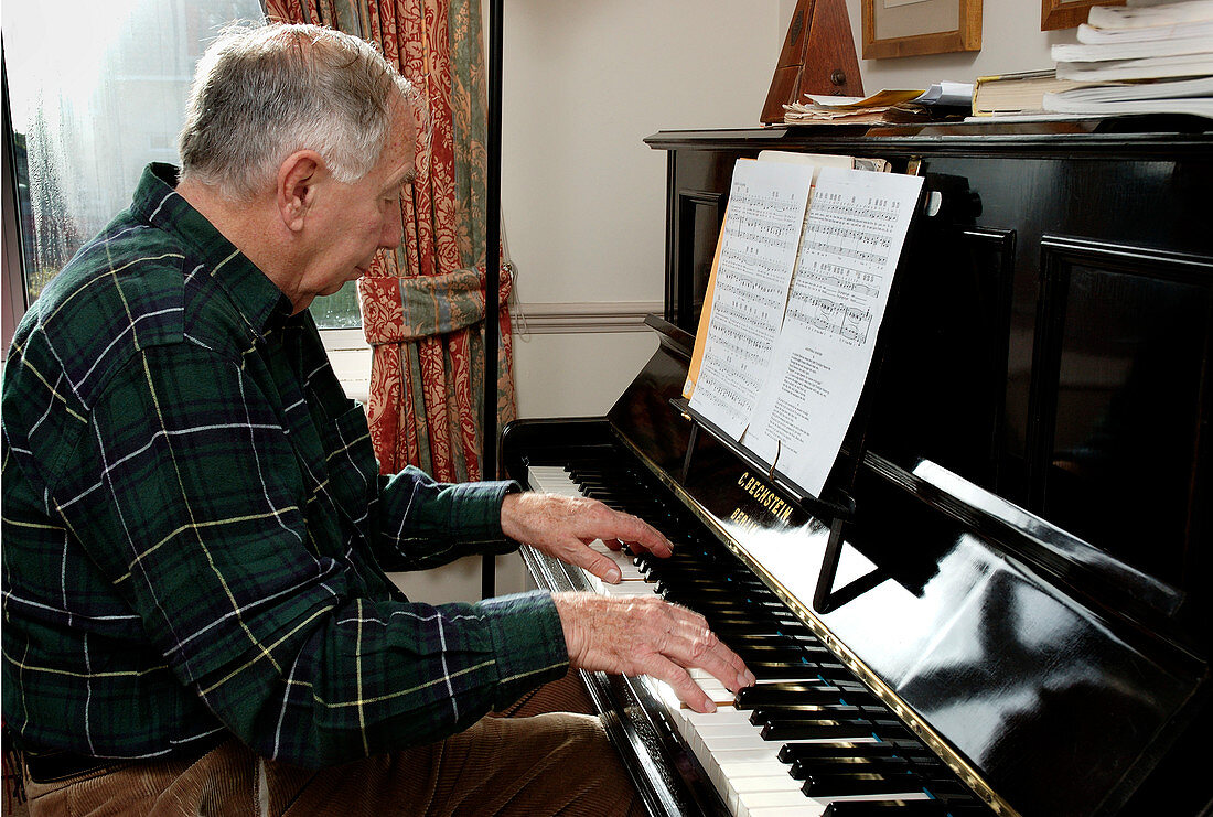 Elderly man playing the piano