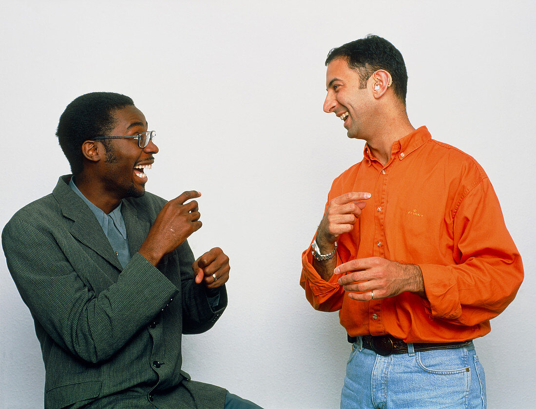 Two men using sign language