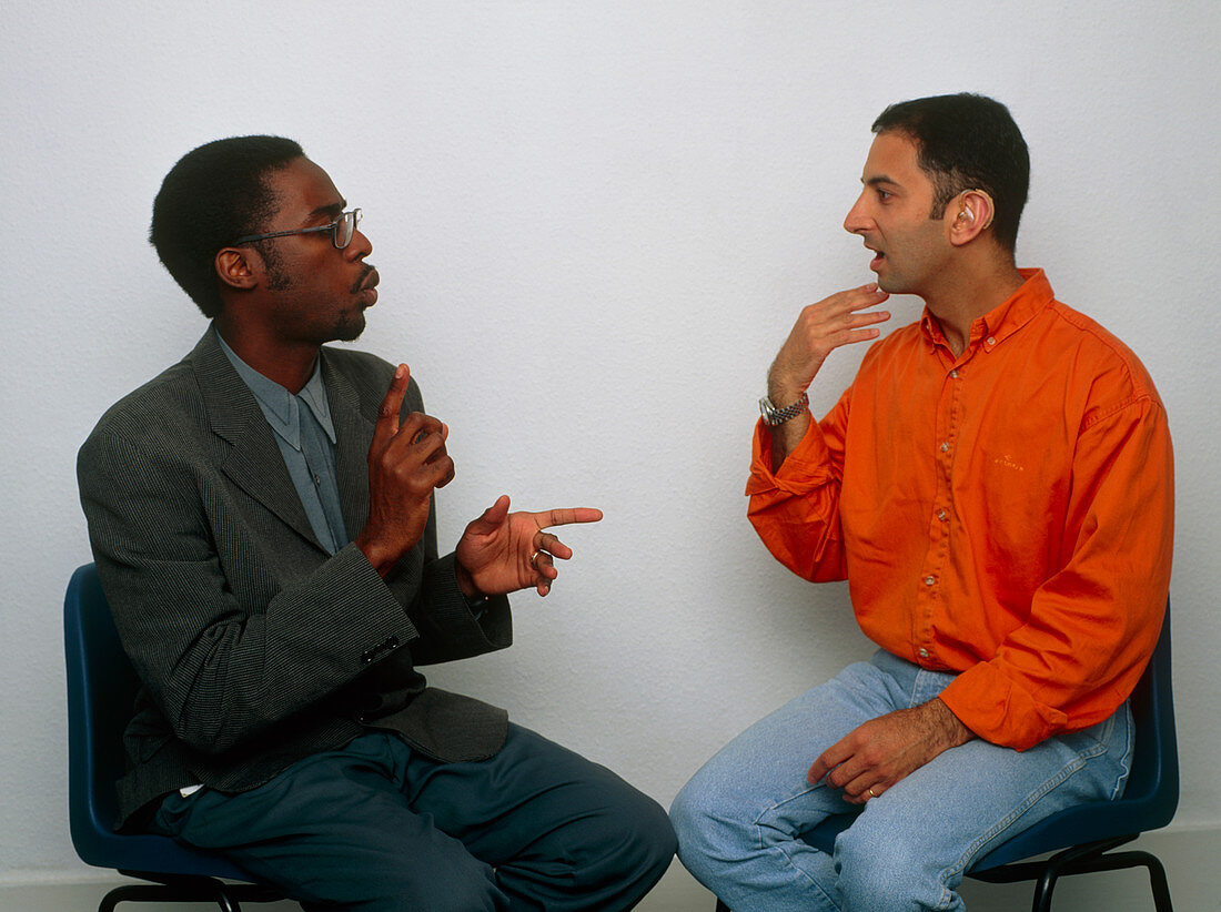 Two men using sign language