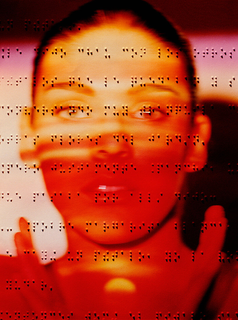Blind woman's face on a sheet written in braille