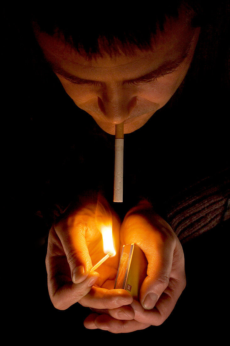 Man lighting a cigarette