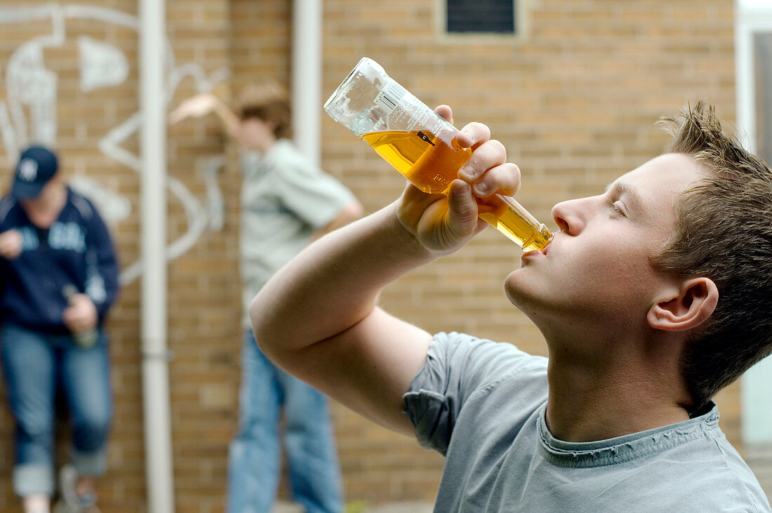 Teenage boy drinking alcohol