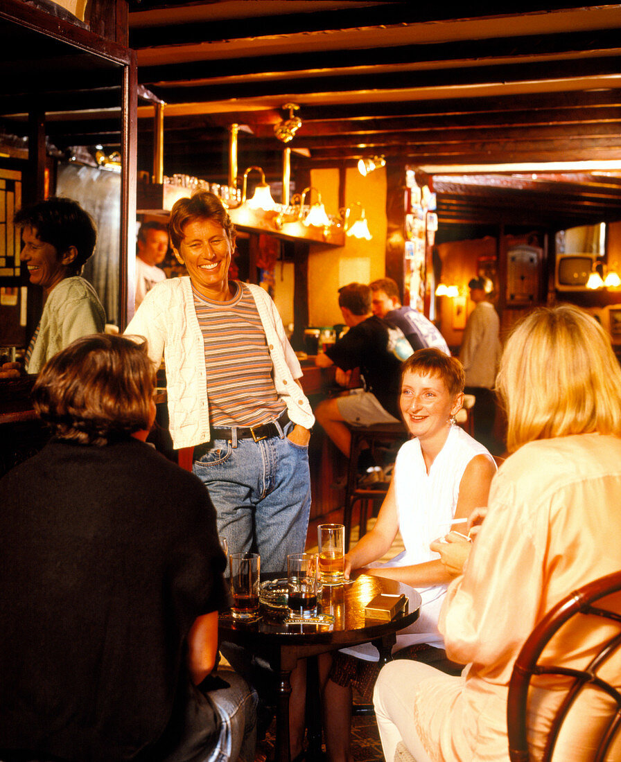 Women drinking alcohol in a bar