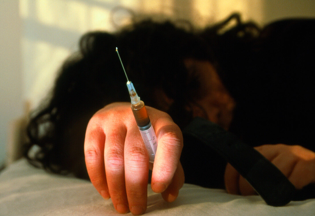 Heroin user slumped after injecting the drug