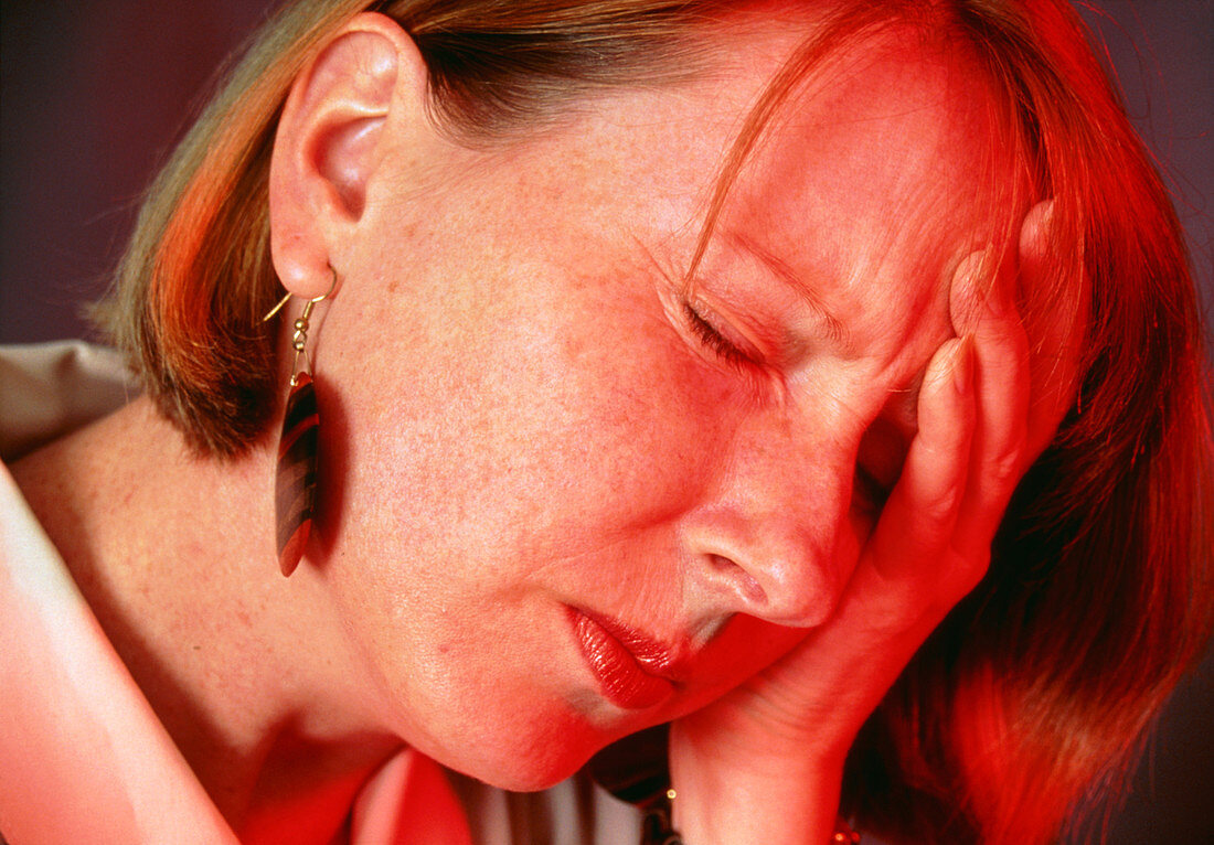 Woman suffering a headache or migraine