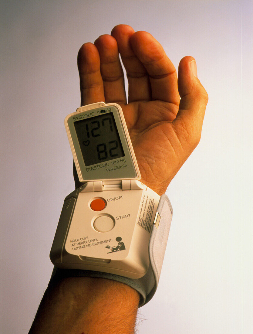 Portable blood pressure device on man's wrist