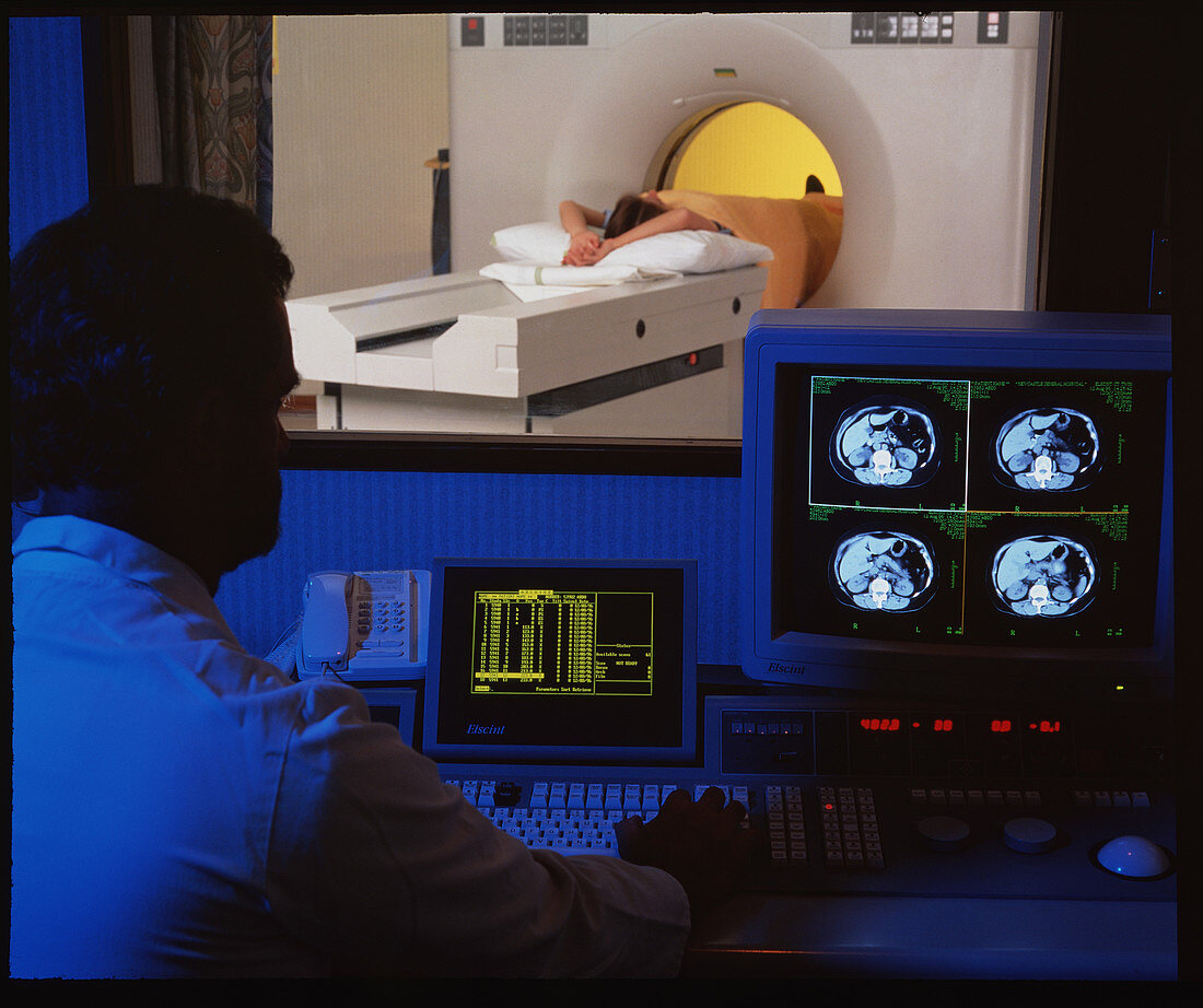 Patient undergoing CT scan seen from control room