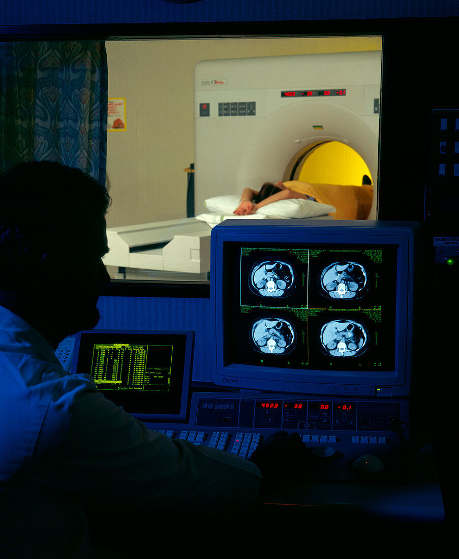 Patient undergoing CT scan seen from control room
