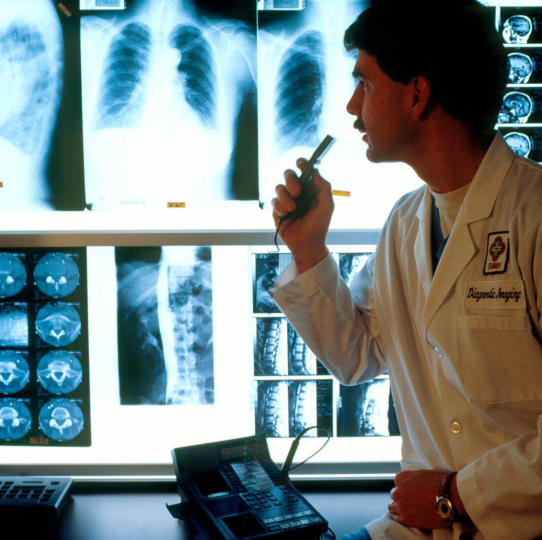 Radiologist examining X-ray images