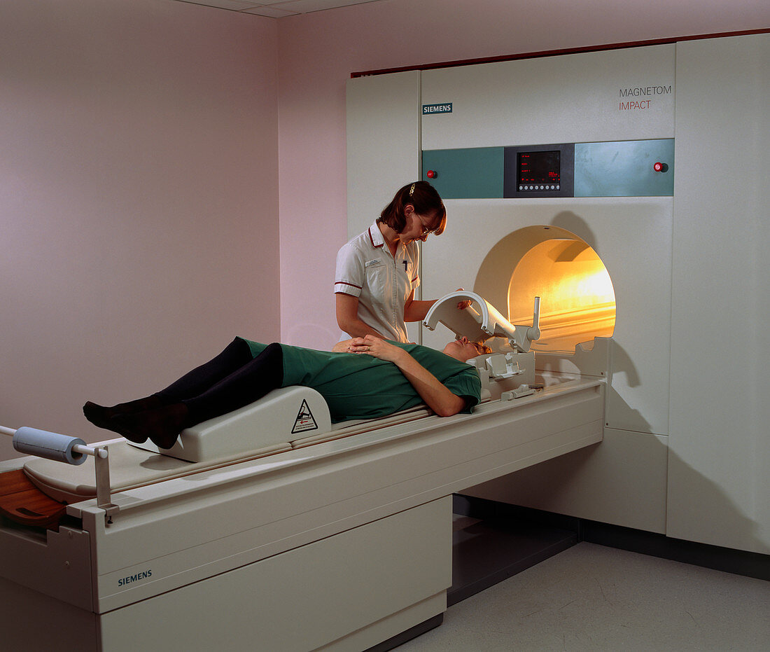 A woman patient is prepared for a MRI brain scan