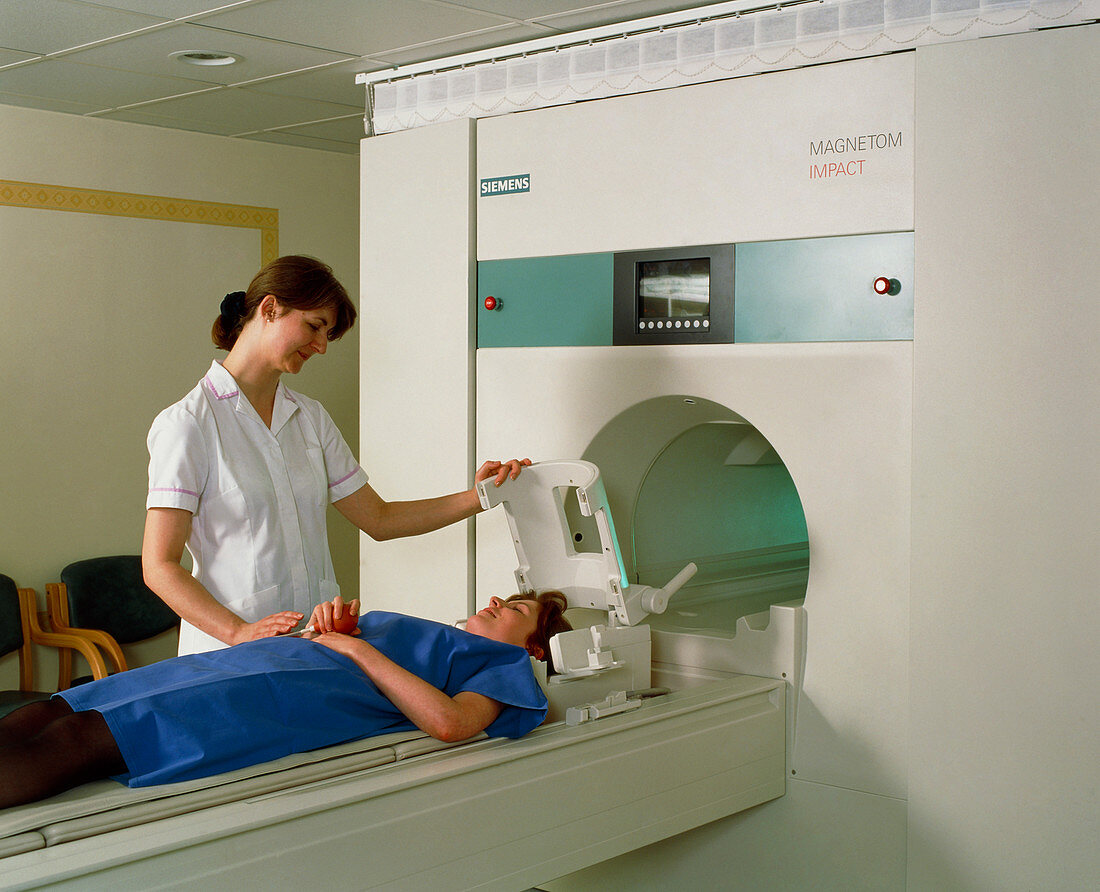 A woman patient is prepared for an MRI brain scan