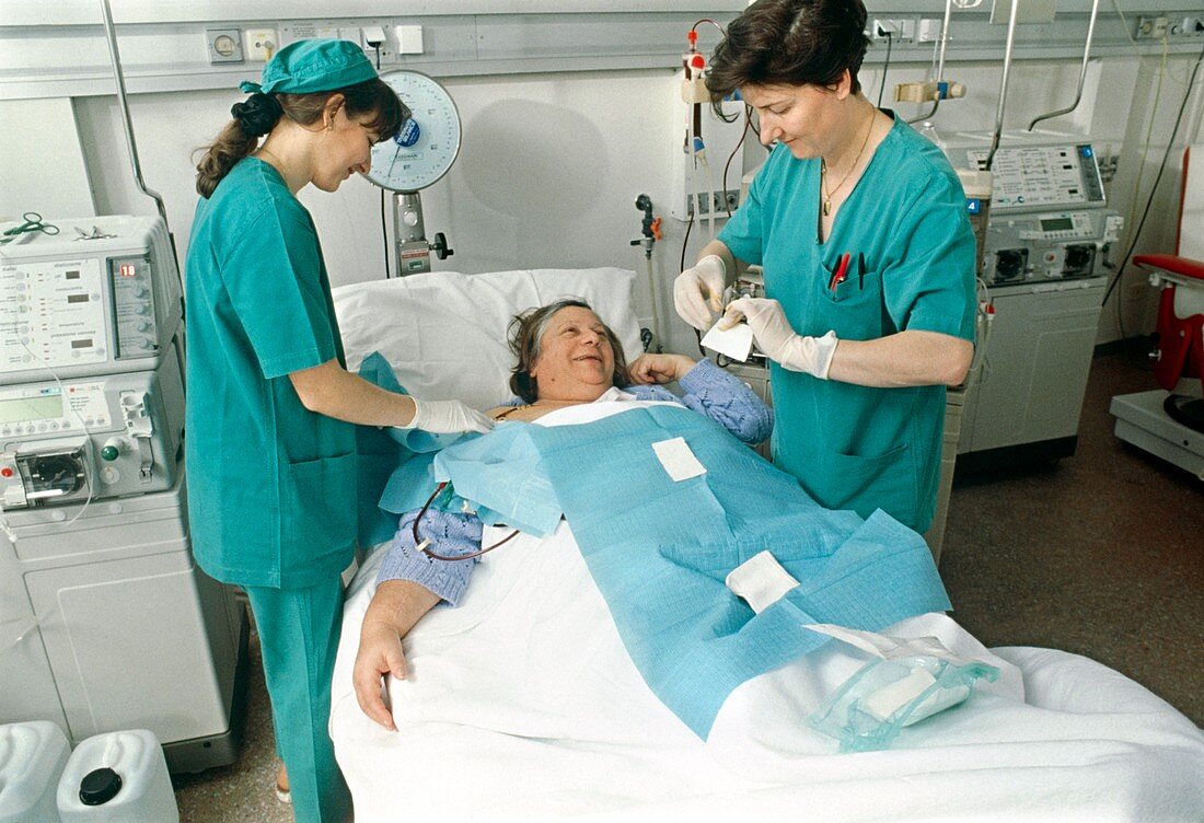 Elderly woman is prepared for kidney dialysis