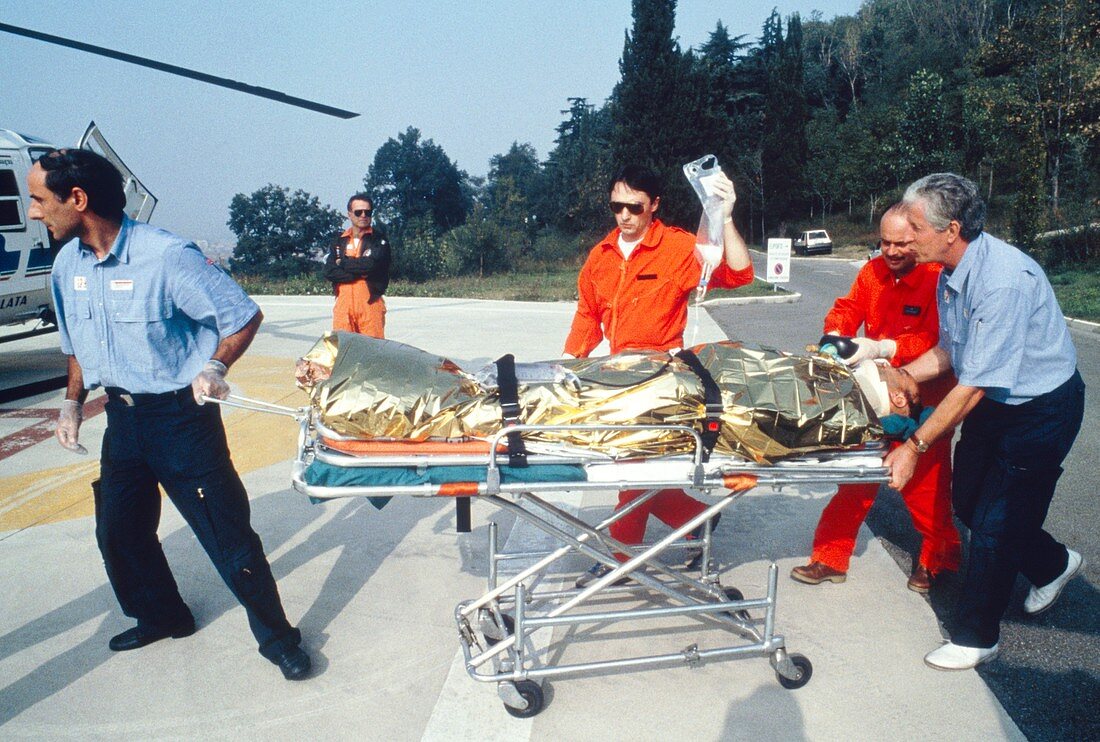 Paramedics transferring patient to air ambulance