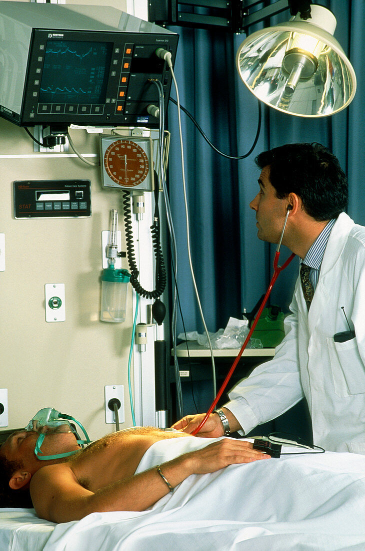 Doctor with a male patient in intensive care