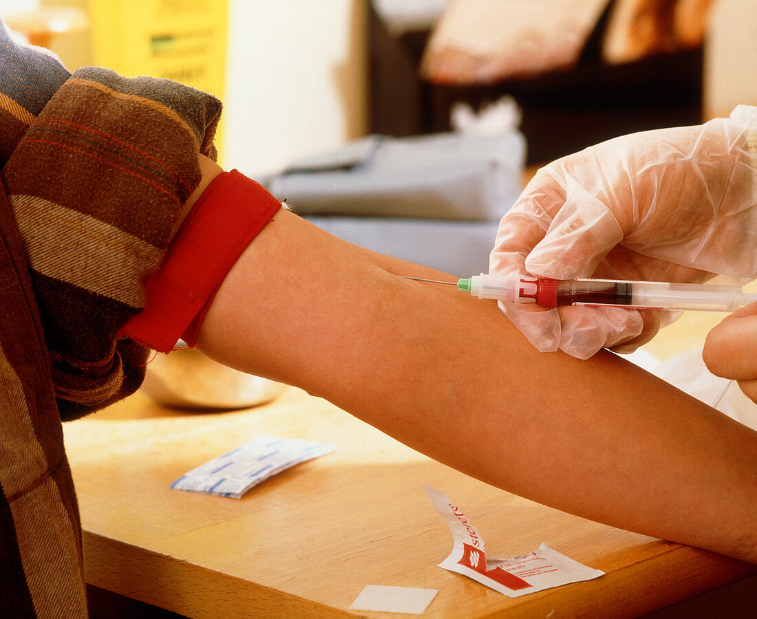 Blood sample being taken from a person's arm