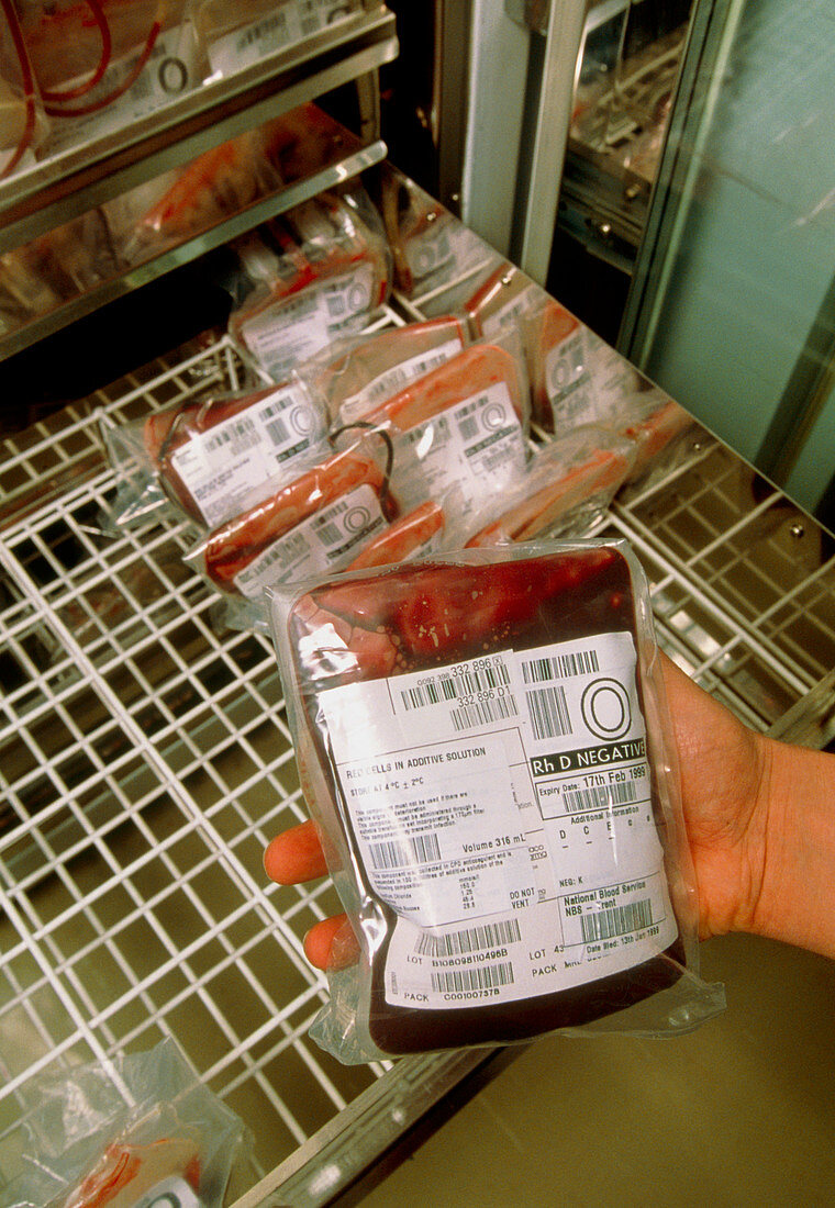 Hand removing a blood bag from a blood bank