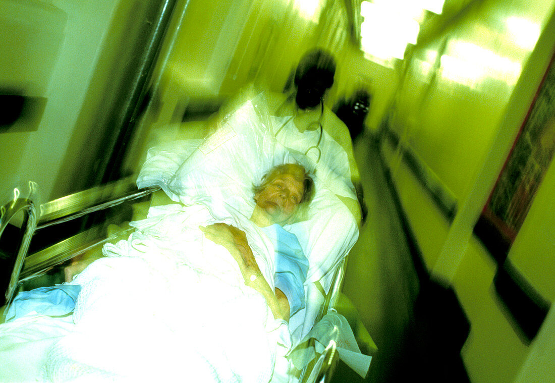 Medical worker moving patient