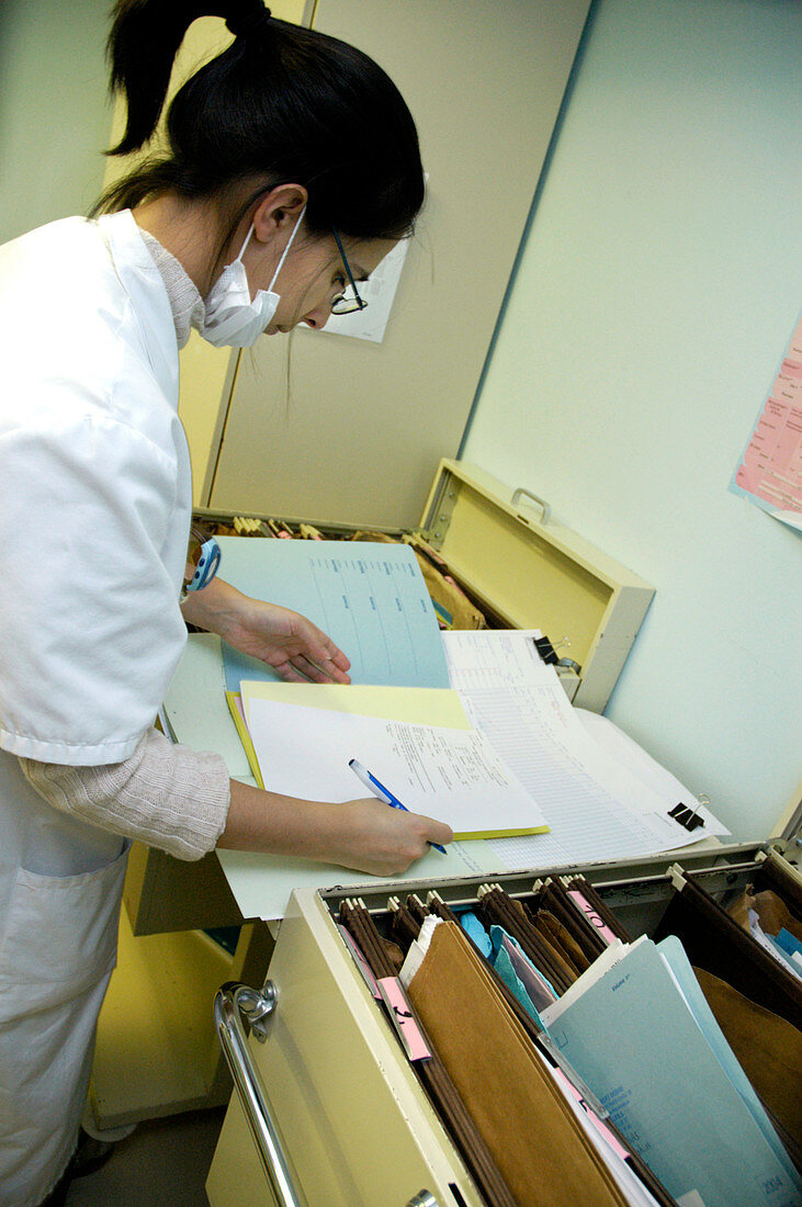 Doctor checking records