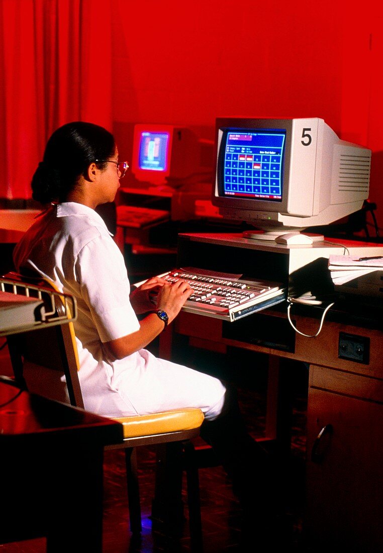Student nurse views medical records on a computer