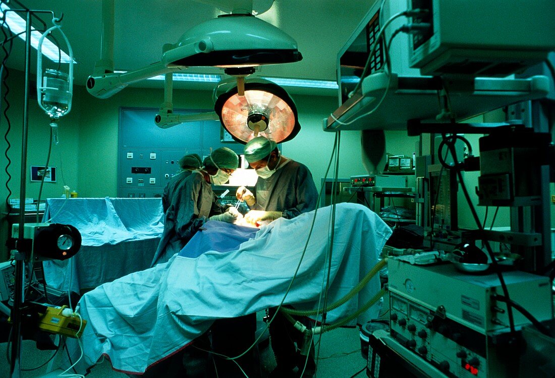 Surgeons operating on a cancerous breast