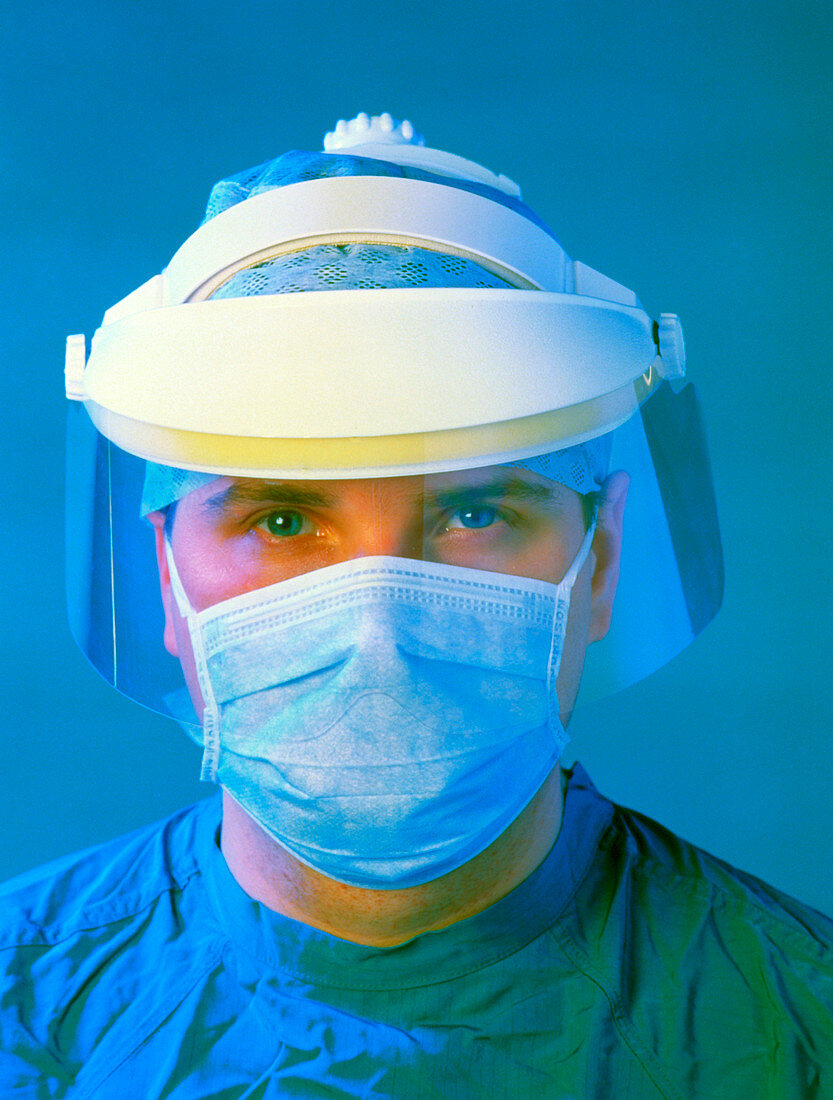 Surgeon wearing plastic face mask