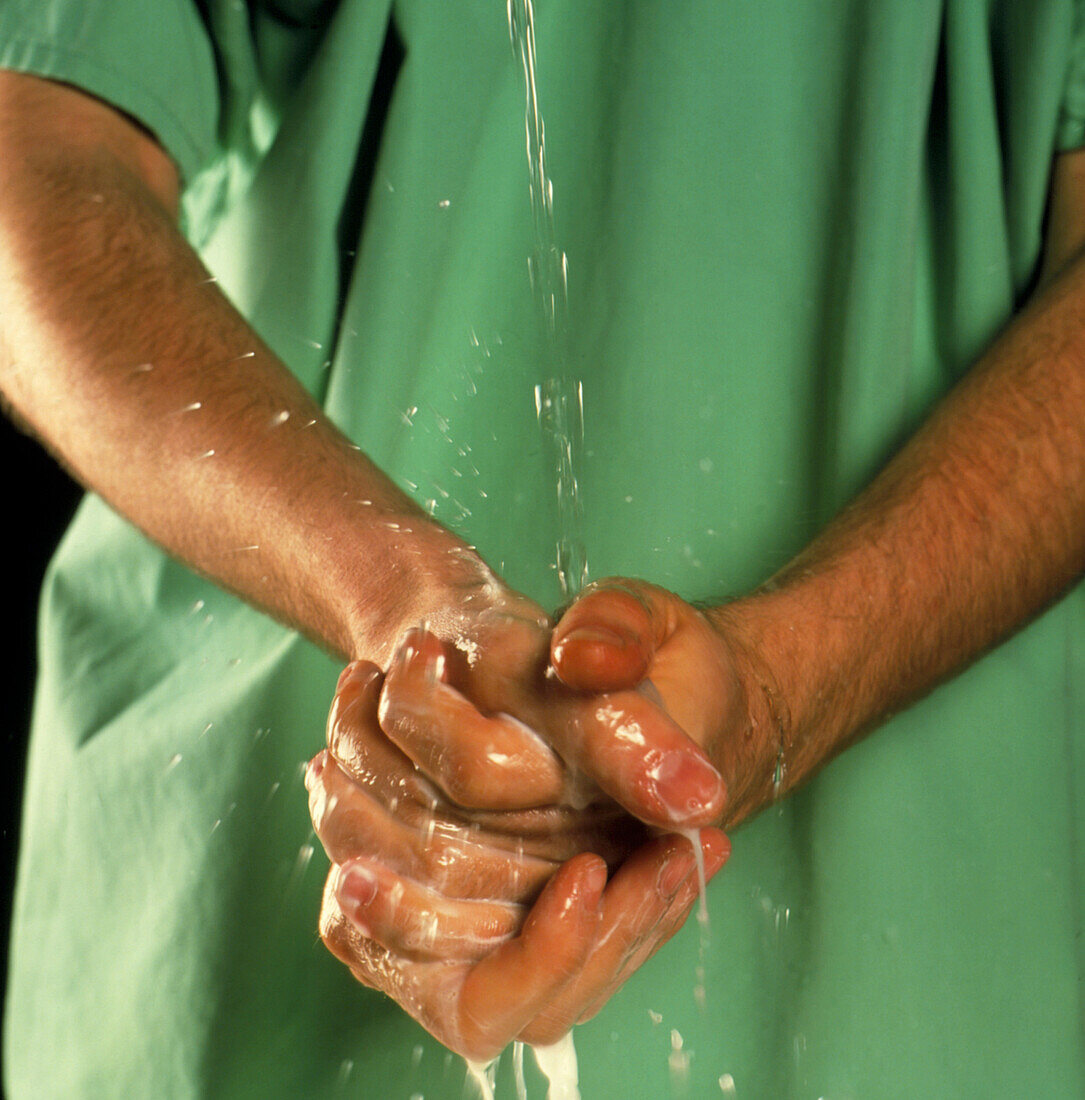 Surgeon scrubbing his hands before an operation