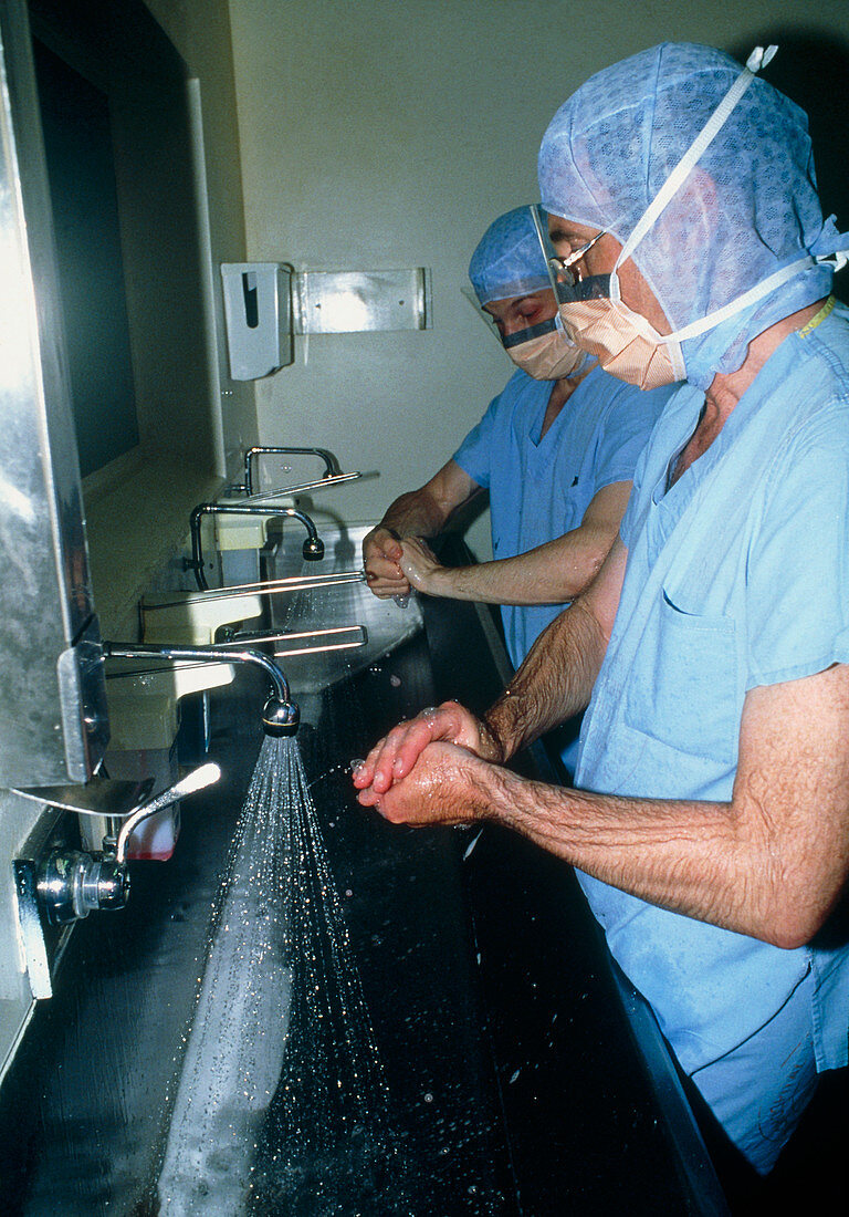 Surgeons scrubbing hands before operation