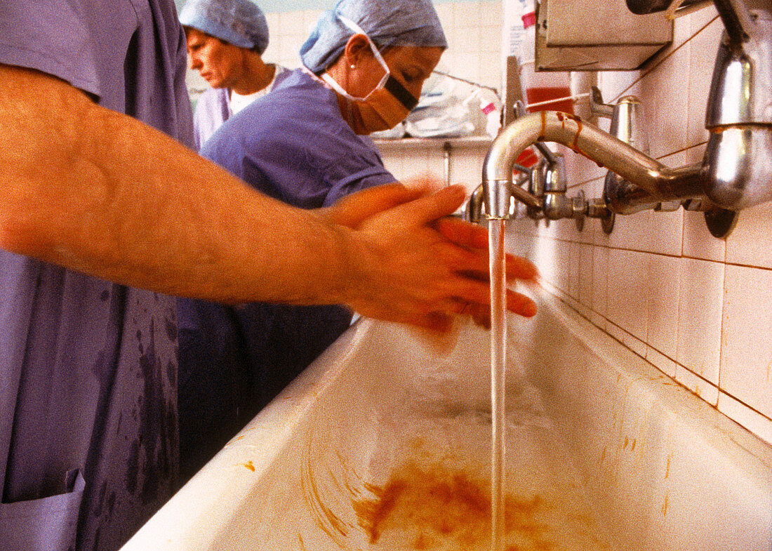 Surgeons scrub hands