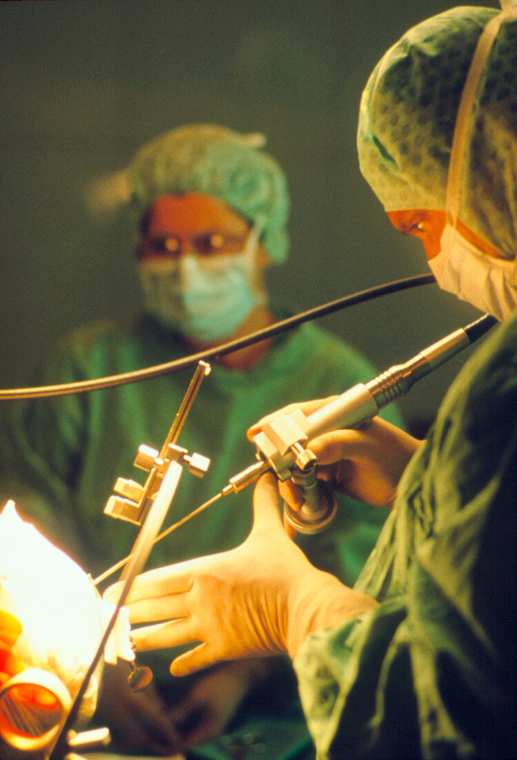Neurosurgeon performs brain biopsy on a patient