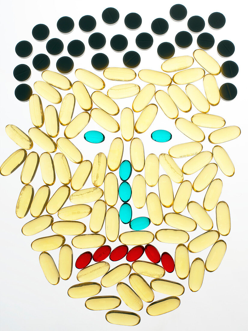 Unhappy face made from pills