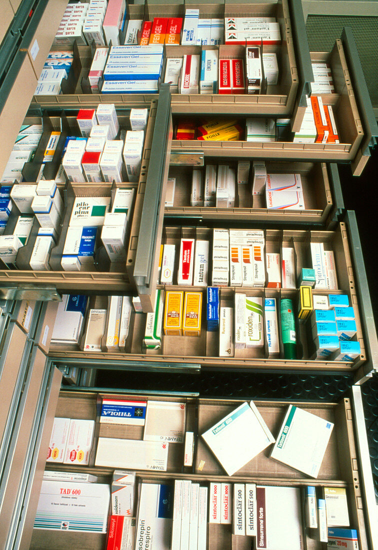Several drawers in a pharmacy containing drugs