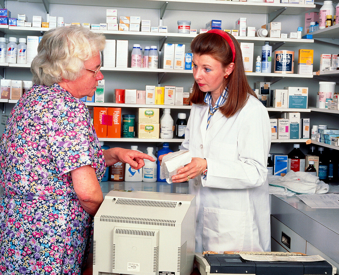 Pharmacist discusses prescription with a patient
