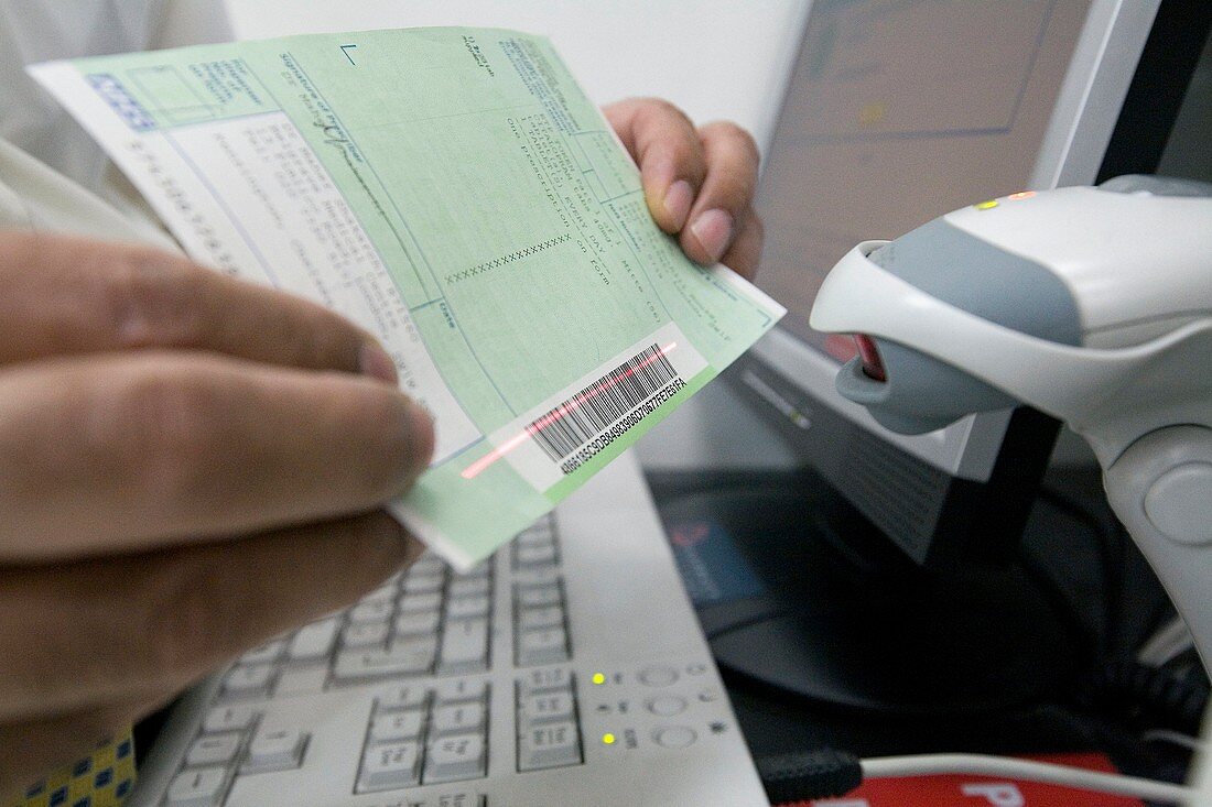 Pharmacist scanning a barcode