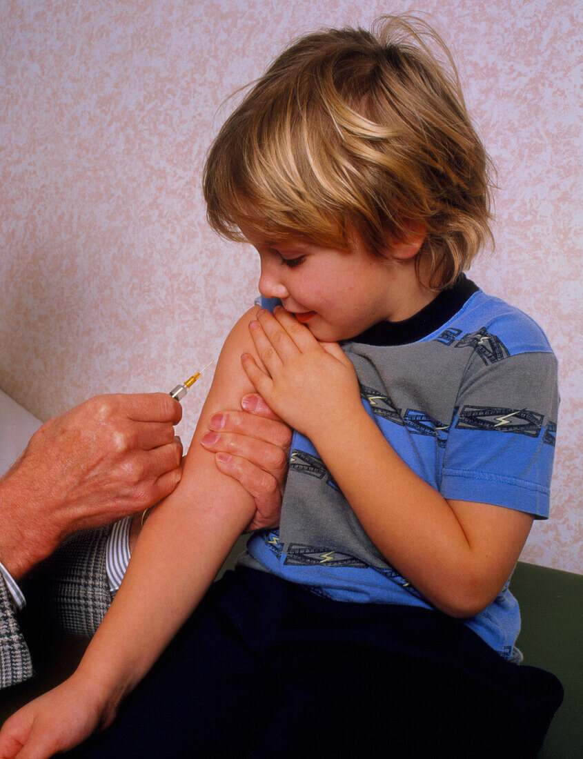 DPT booster vaccination on a young child