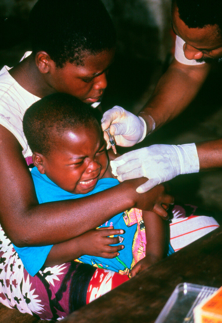 Child being vaccinated against malaria,Tanzania