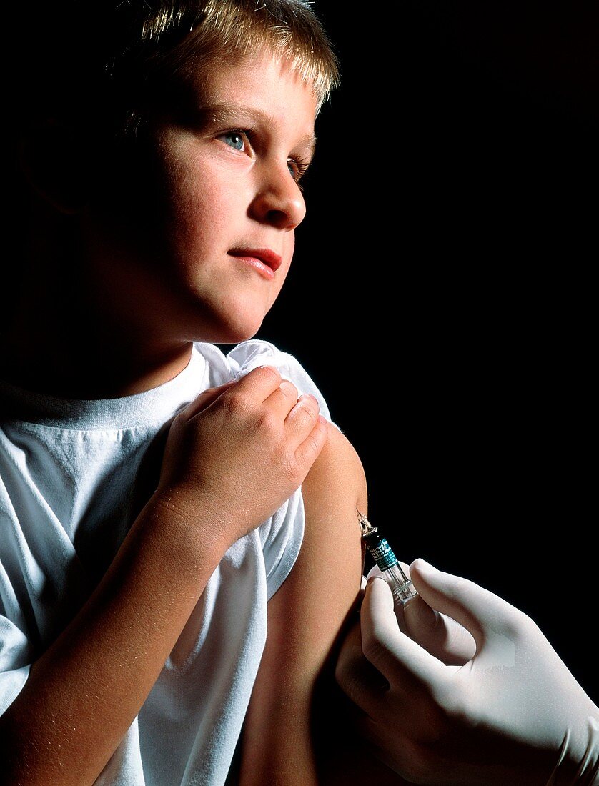 Boy,aged 5-10,having tetanus booster injection