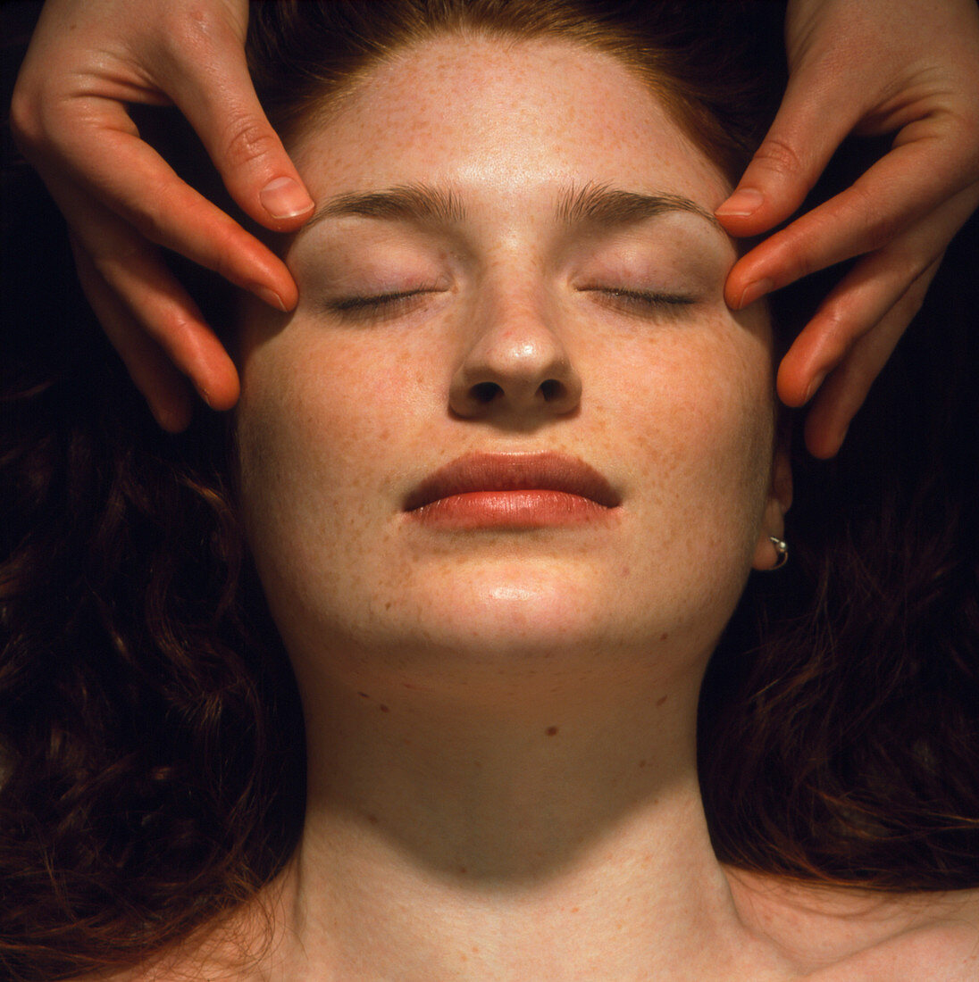 Woman receives a facial massage