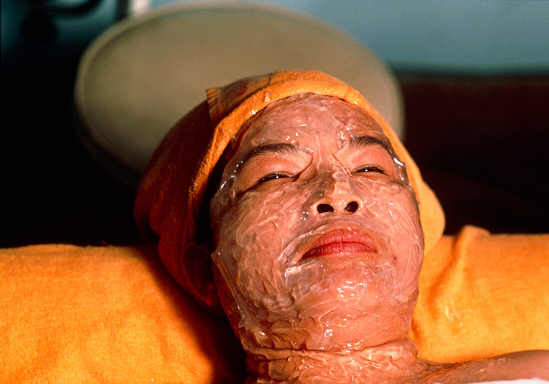 Woman wearing a face pack for beauty therapy